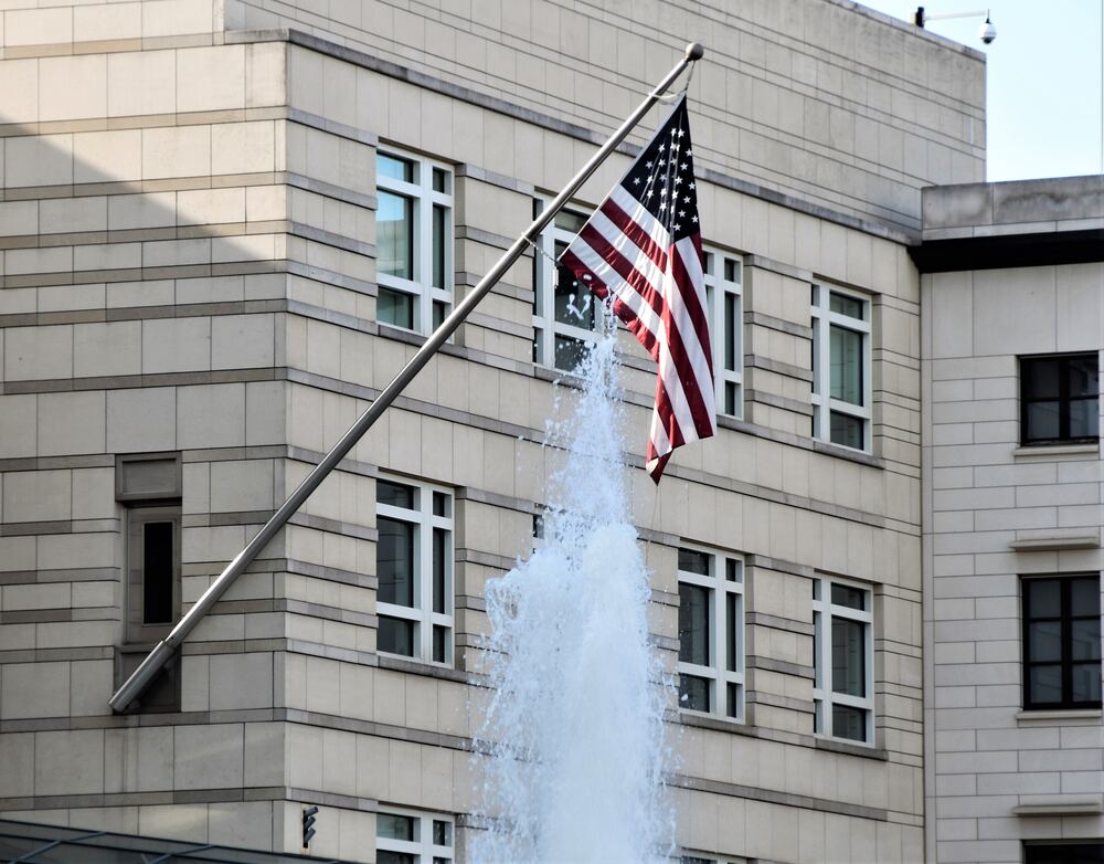 american flag outside embassy