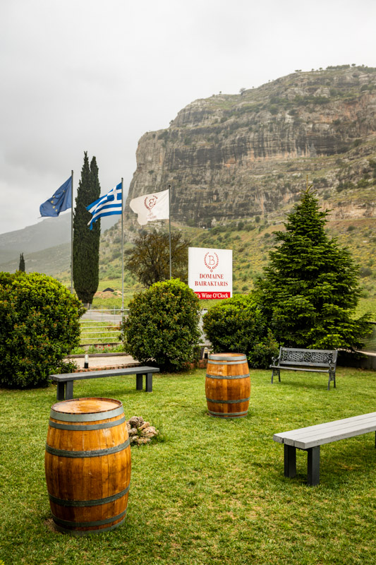garden with wine barrles and seats at Ktimi Bairaktaris Winery