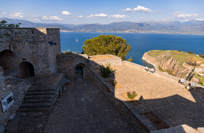 castle walls of palamidi and view of sea in background