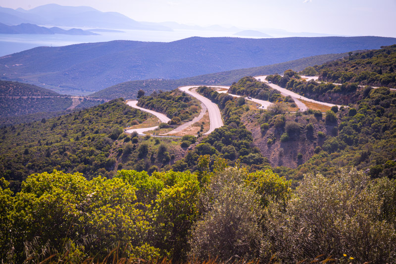 winding road in mountains with coastal views