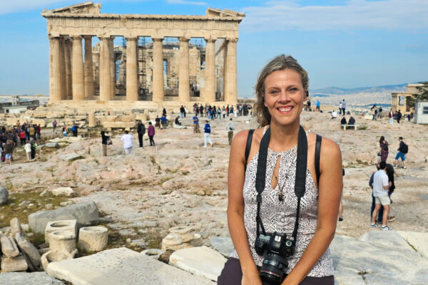 Lady getting her photo in front of a historic site in Athens, Greece