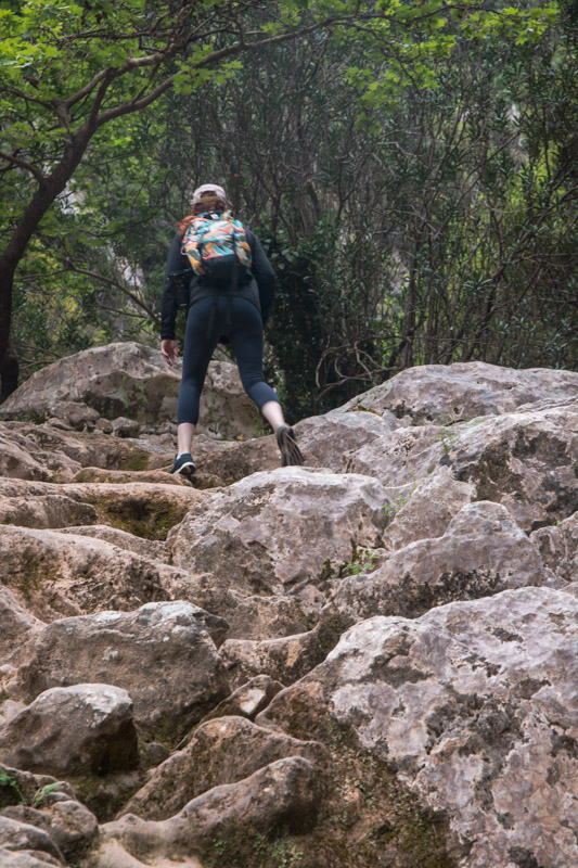 girl hiking on rocks