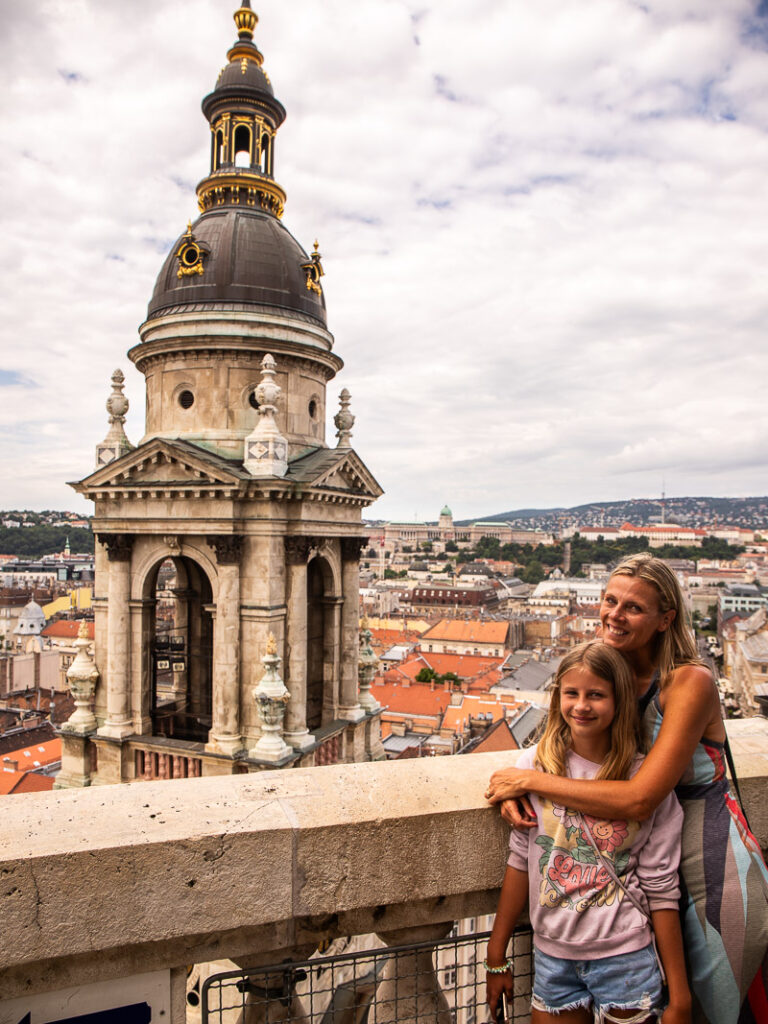 Mom and daughter overlooking a church in Budapest