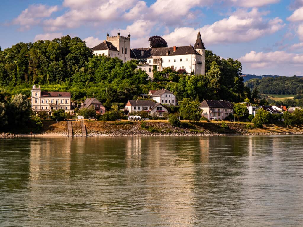View of a castle from a river cruise in Europe