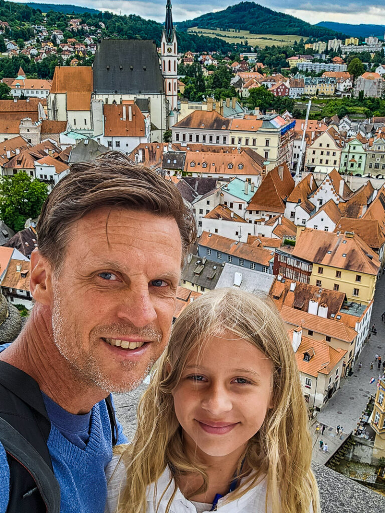 Dad and daughter overlooking the medieval city of Cesky Krumlov in Czech Republic