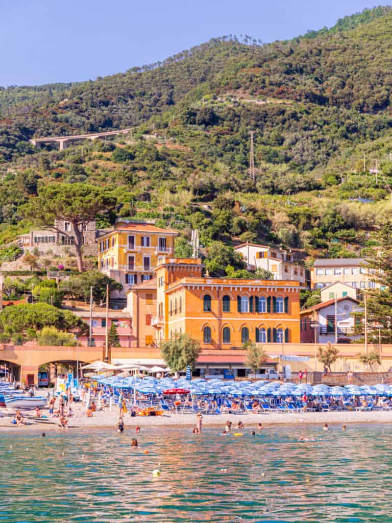 looking at monterosso beach and colored buildings from the ocean
