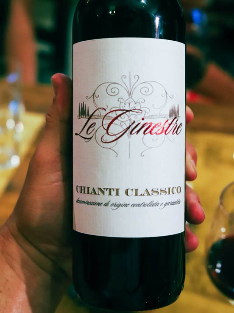hand holding bottle of chianti classico