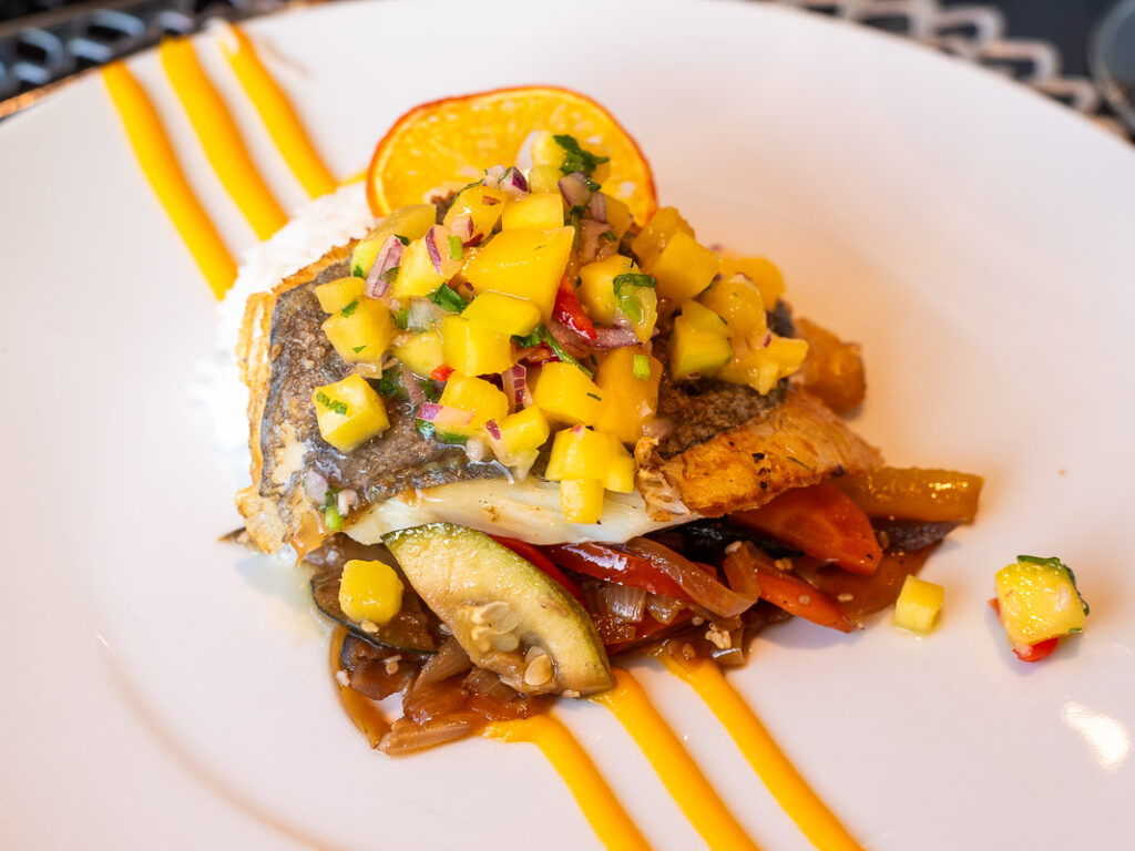 Fish and yellow peppers on a plate