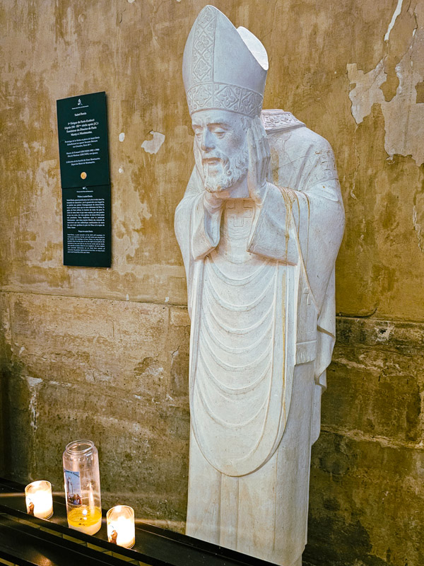 statue of saint dennis in Church of Saint-Pierre de Montmartre holding his head