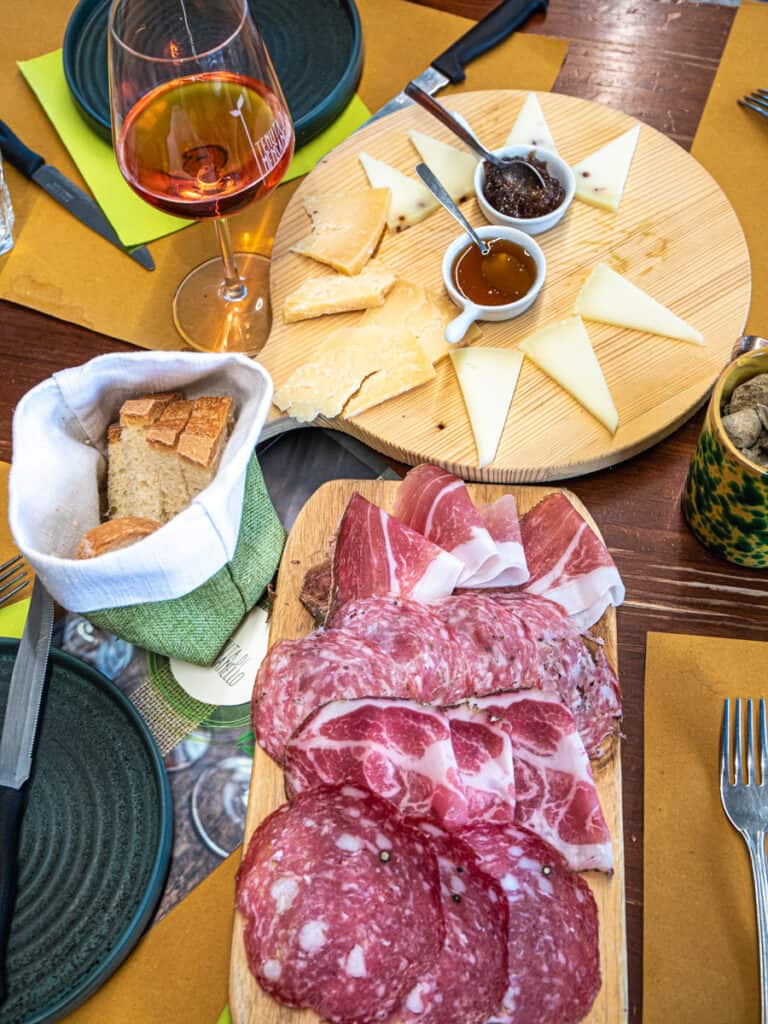 tuscan cured meets and cheese on table