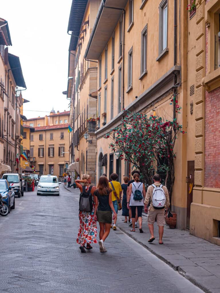 people walking streets of oltrarno