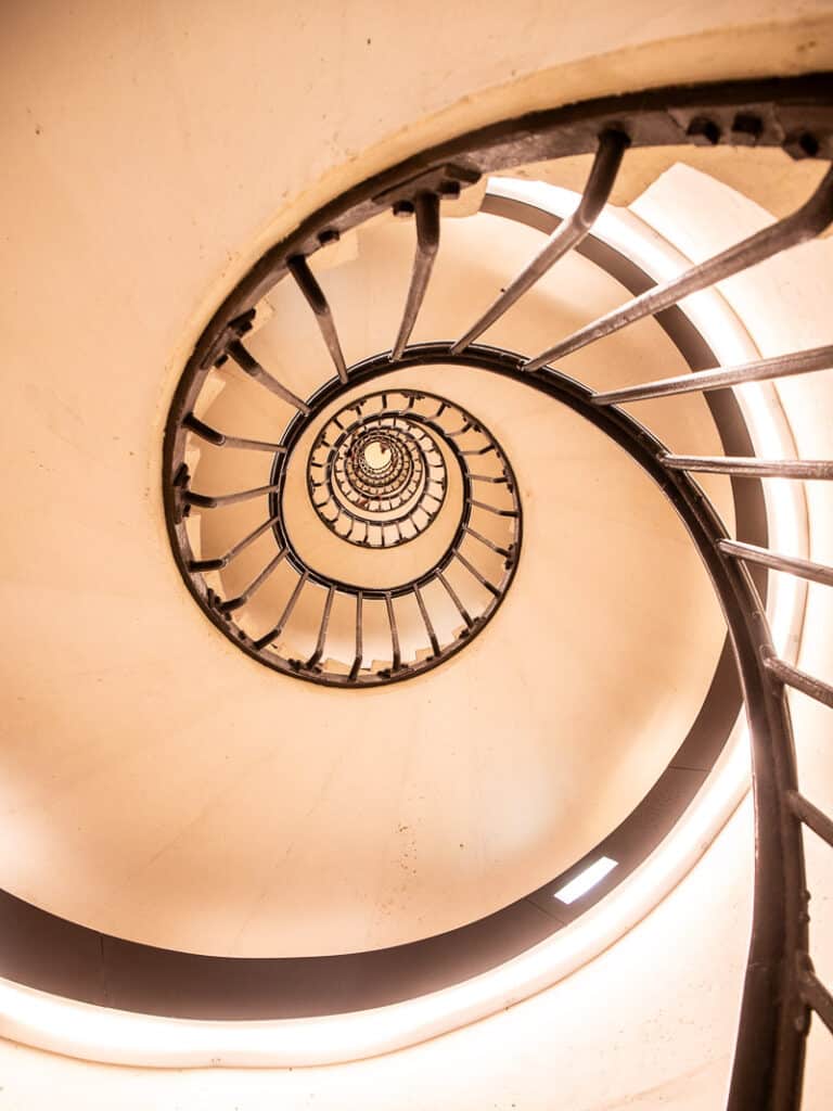 looking up at spiraling staircase