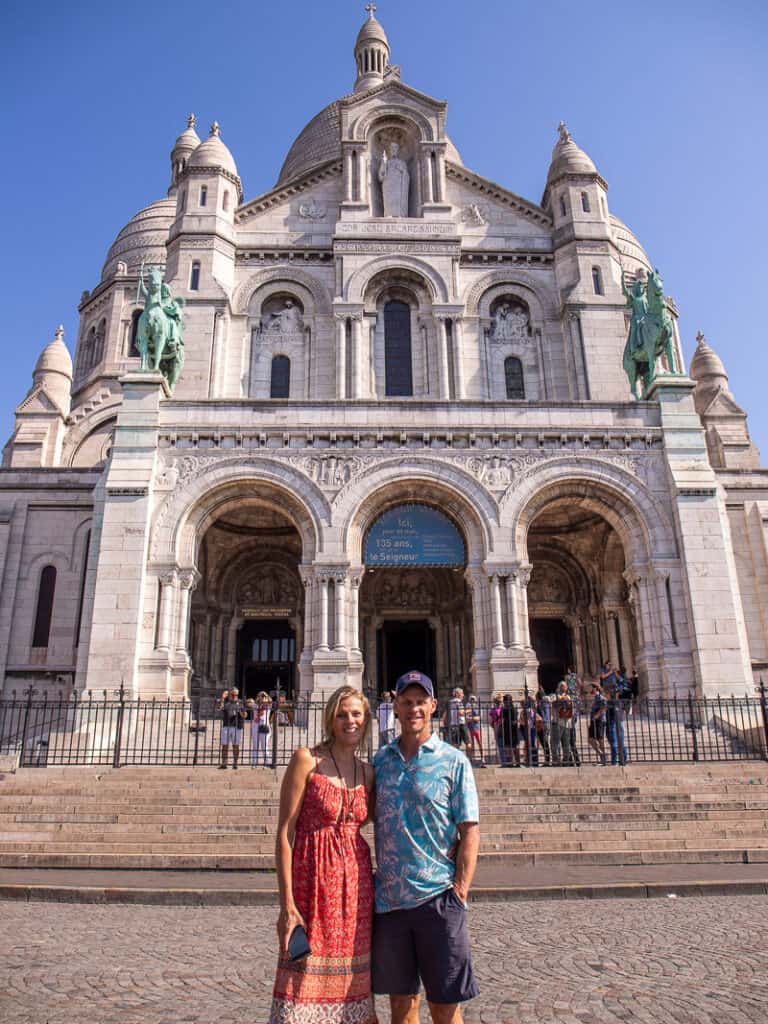 Man and woman outside a Basilica in Paris