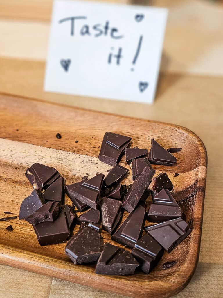 Chocolates on a wooden cutting board