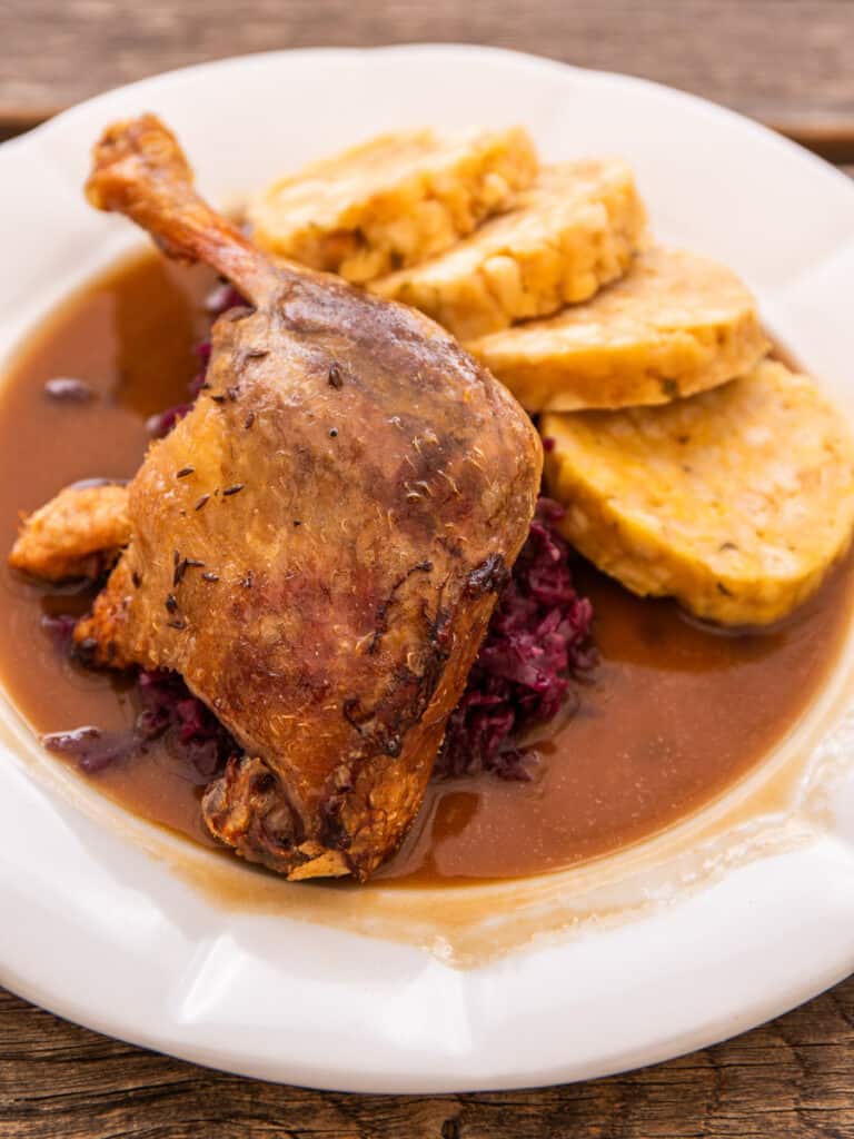 Roasted duck on a plate with gravy