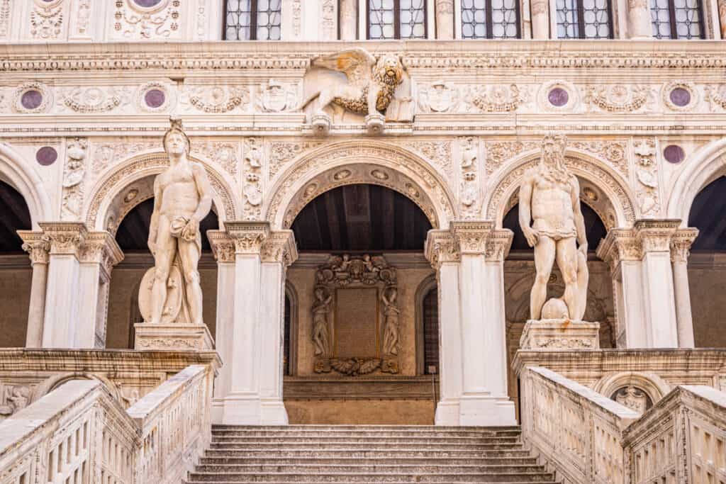 columned entry way to doge's palace with marble statues