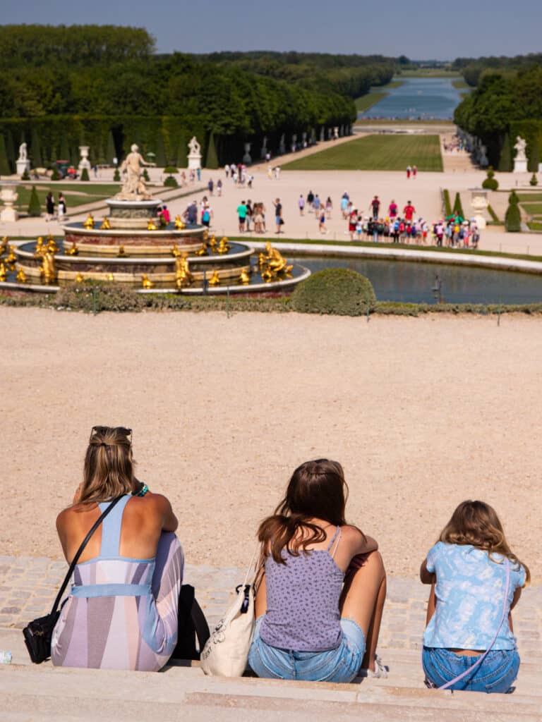 caz and girls looking at the grand perspective and fountain at versailles