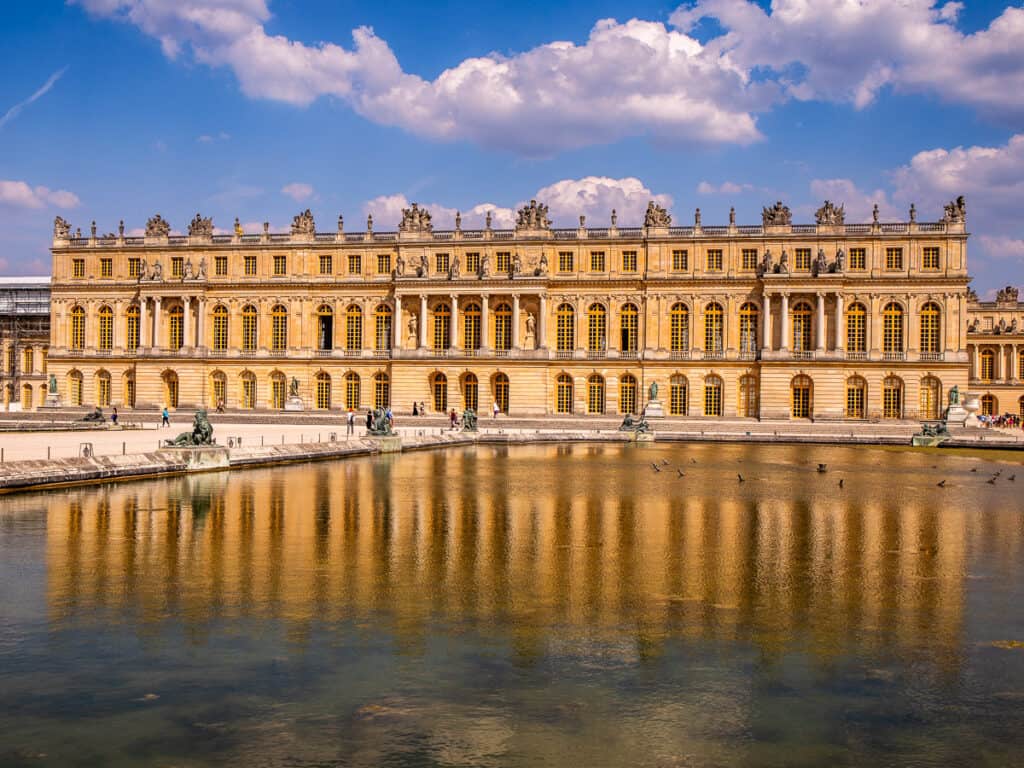 pond in front of palace of versailles