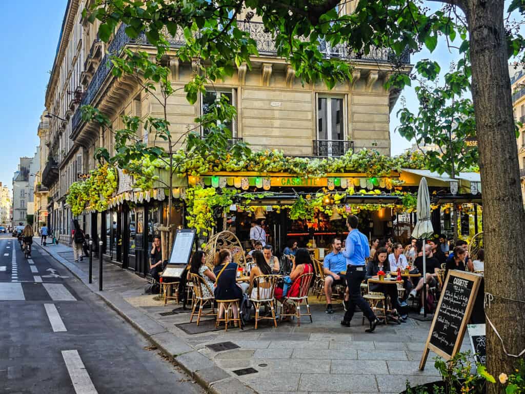 People sitting outside a cafe in Paris