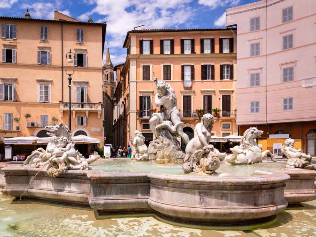 fountain with statues in the middle piazza navona