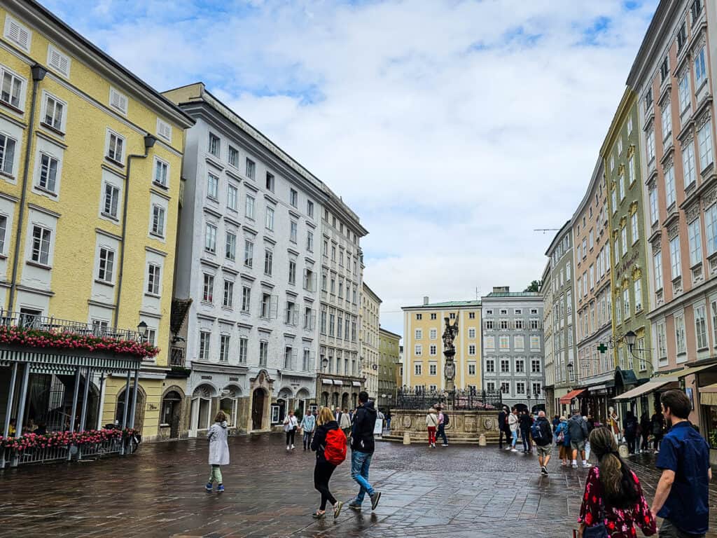 People in a city square in Salzburg, Austria