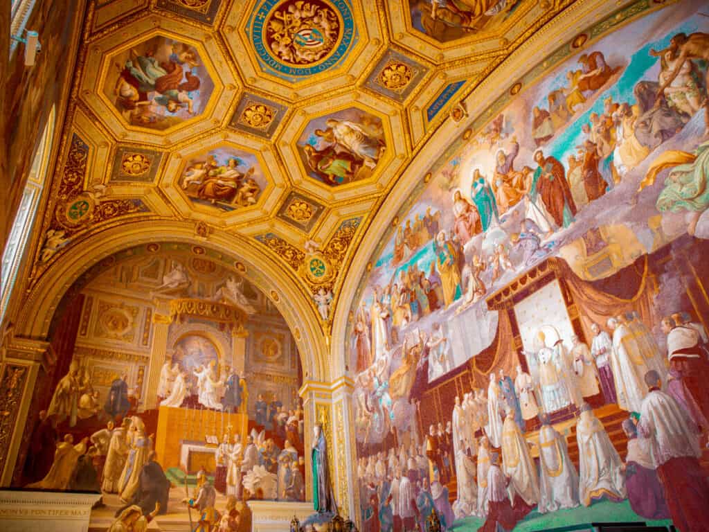 frescoes on wall inside vatican museum