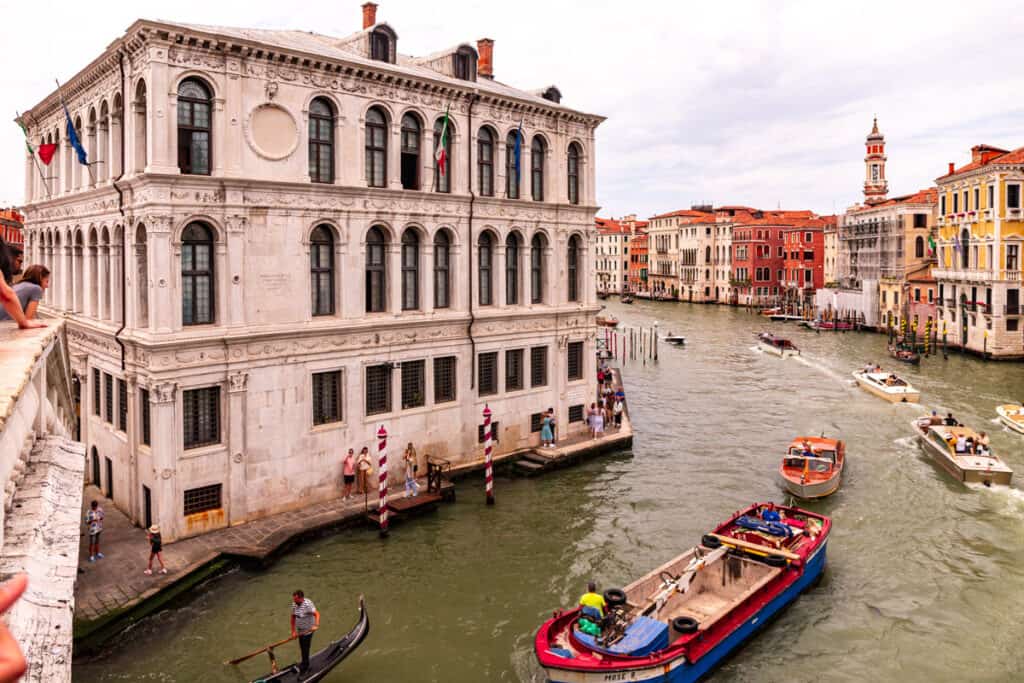 boat going past buildings on grand canal