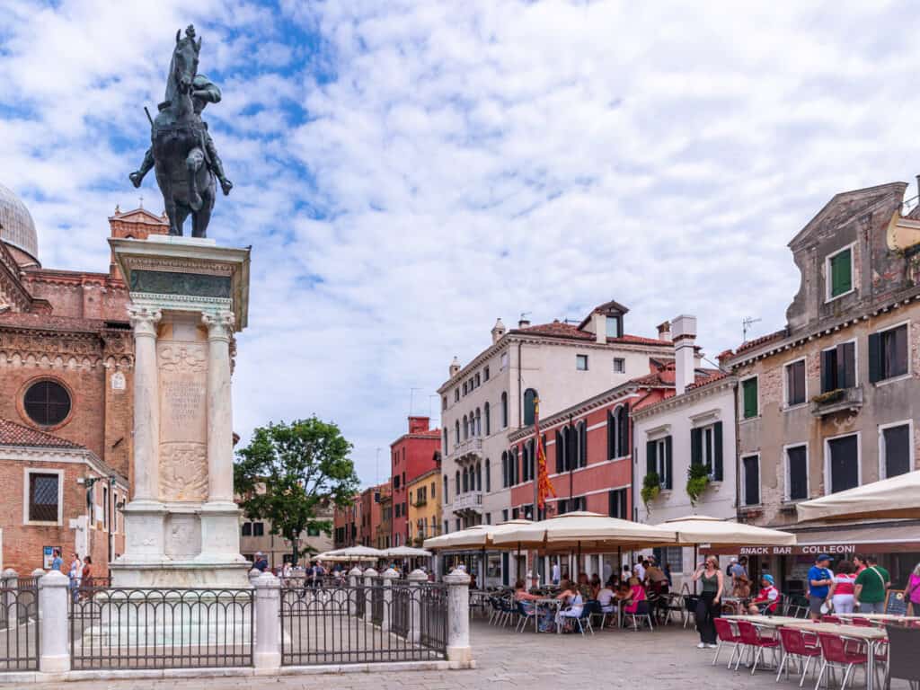  Santi Giovanni e Paolo, statue of man on horse and restaurants on square with outdoor seating