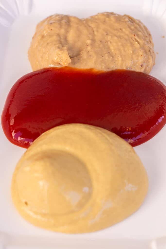 Three types of sauce on a plate