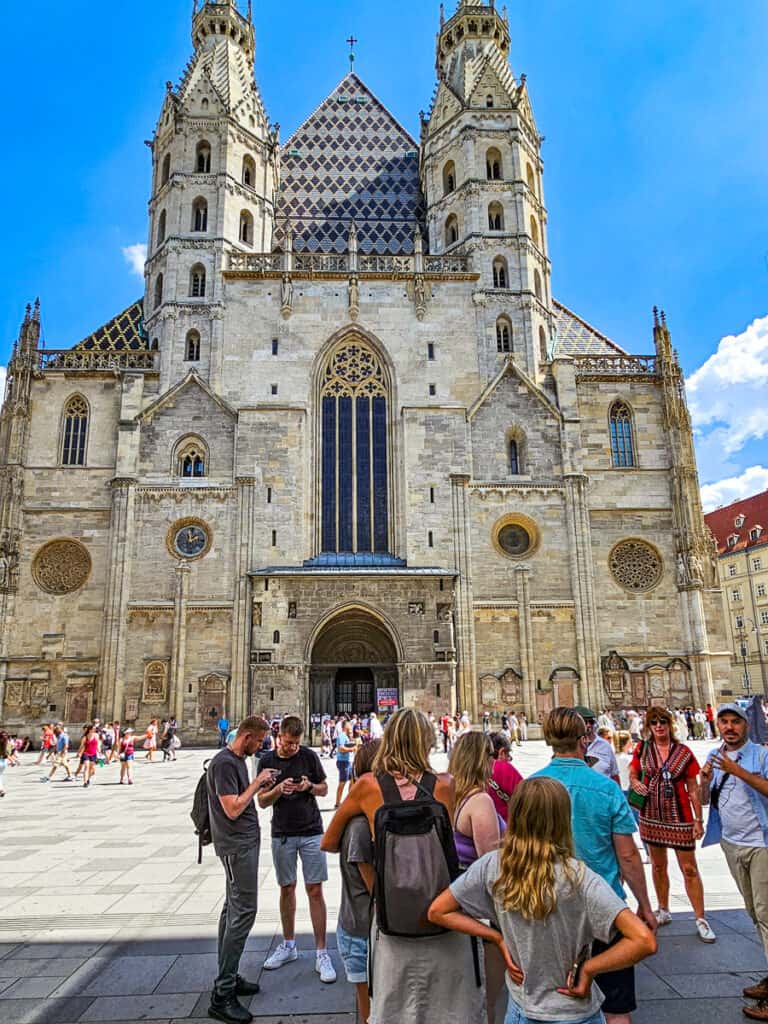 People standing in front of a cathedral