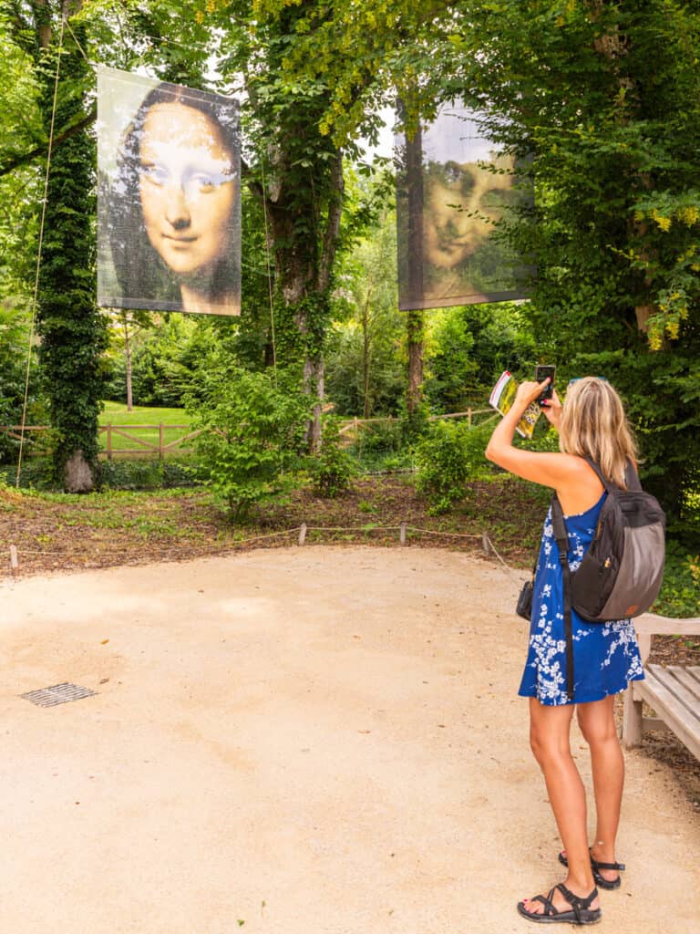 caz taking photos of mona lisa painting in trees