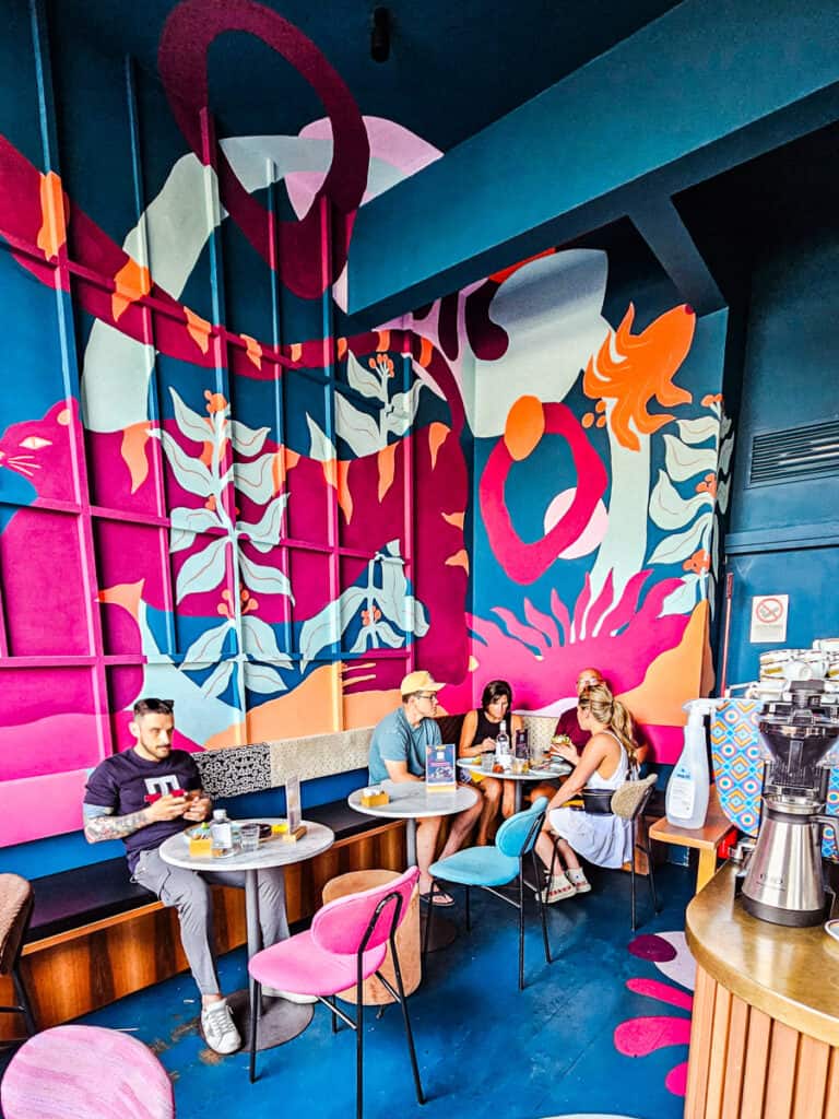 colorful mural on wall of cafe