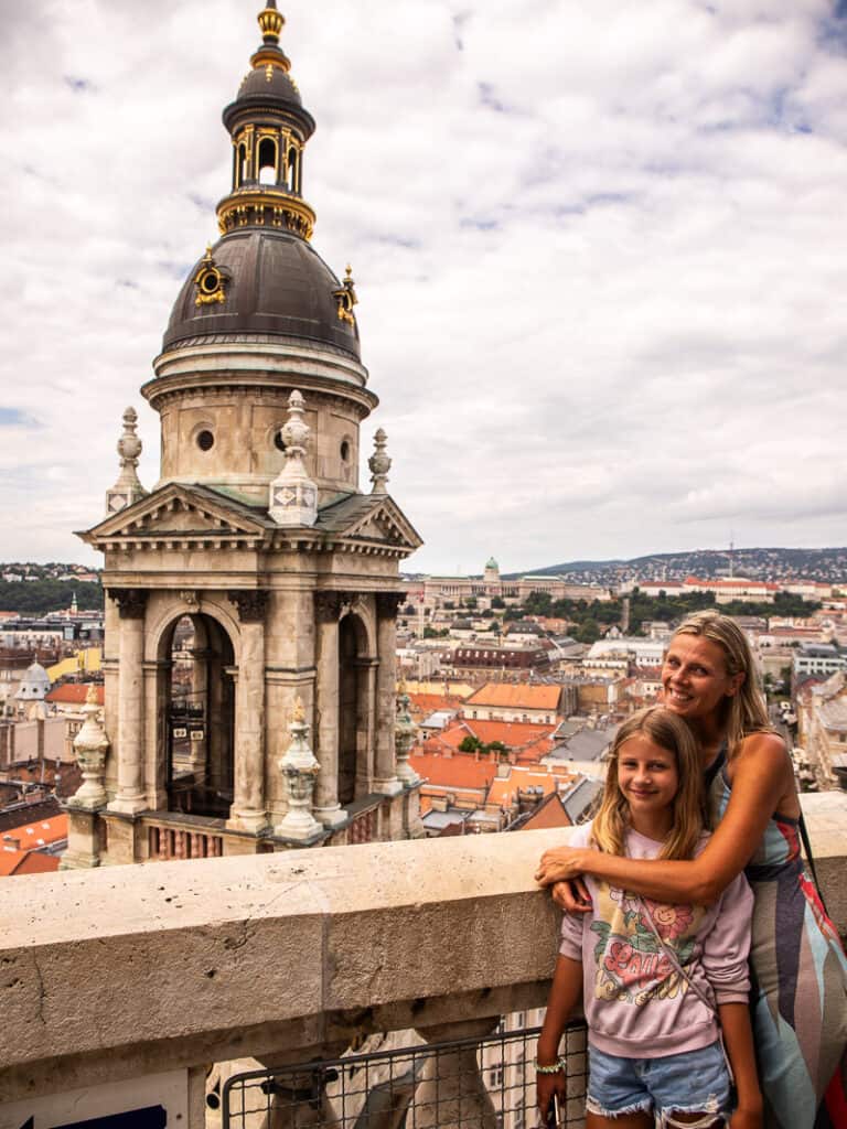 Mom and daughter standing on a balcony of a church in Budapest, Hungary