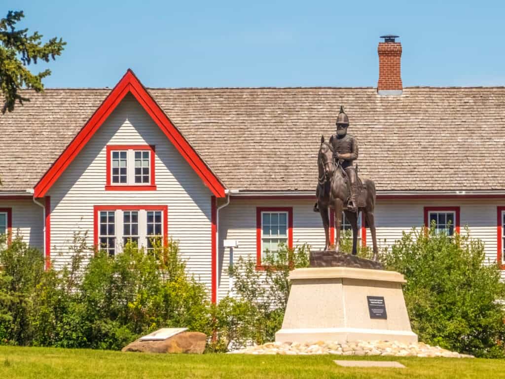 monument of man on horse out front of old fort building