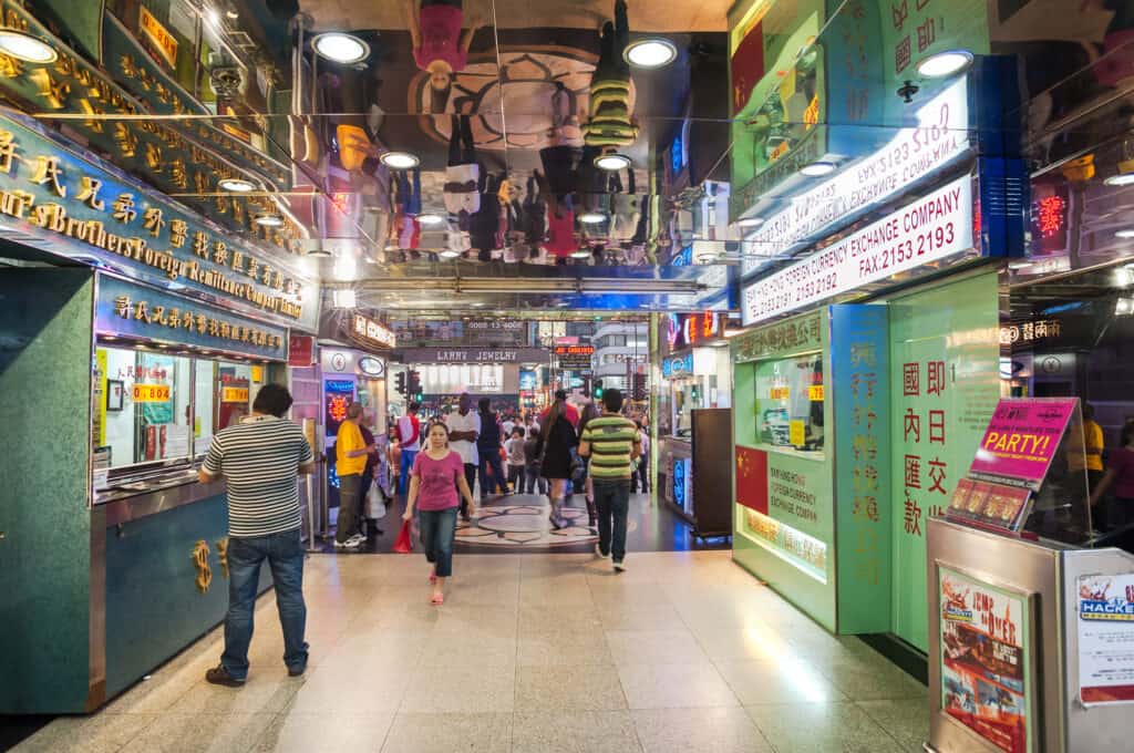 people walking  through the ground floor shopping mall, Hong Kong