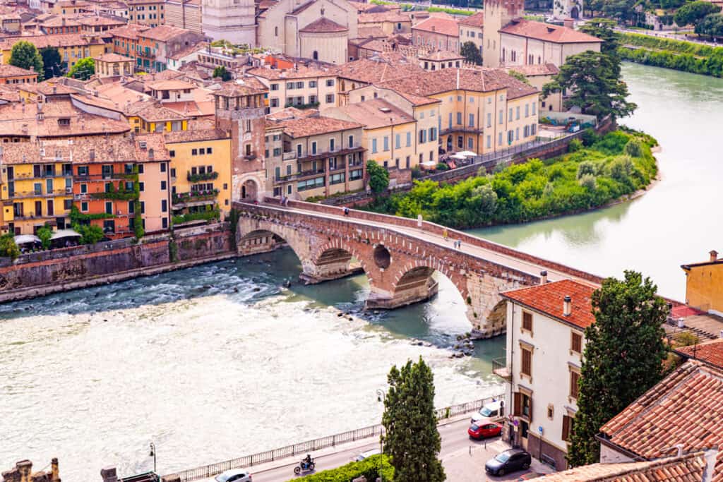 Torre di Ponte Pietra across aidge river