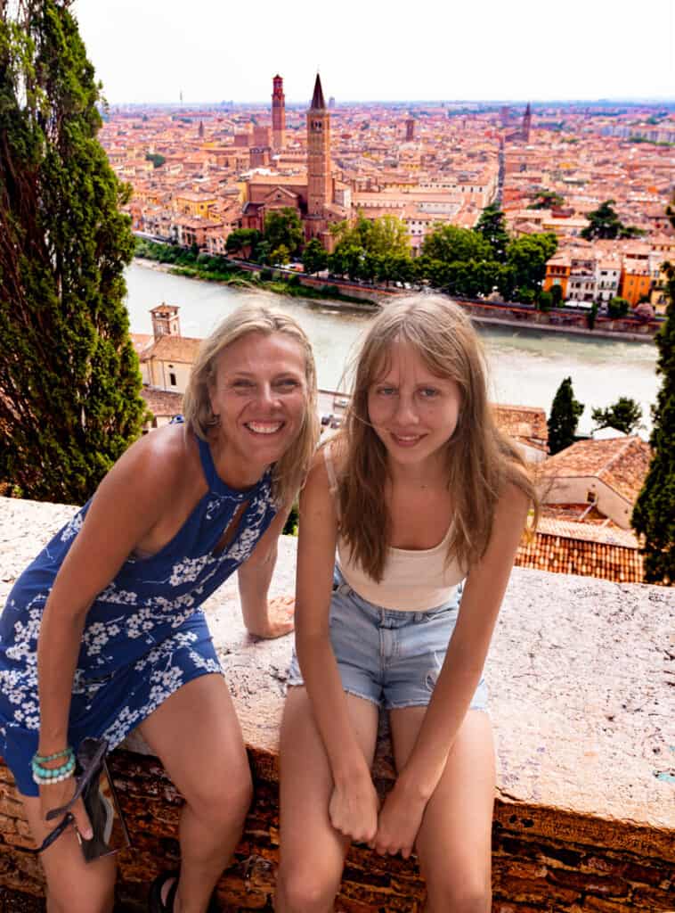 caz and kalyra smiling with view of verona behind them