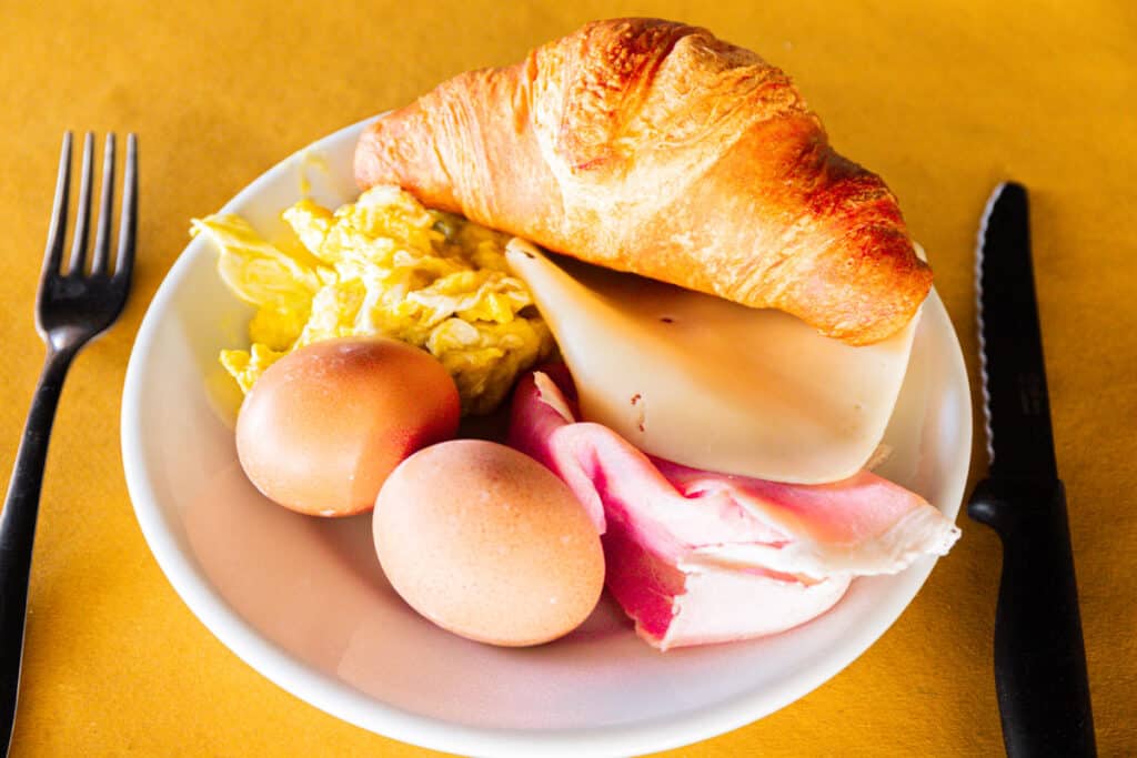 plate of croissant egg and cheese