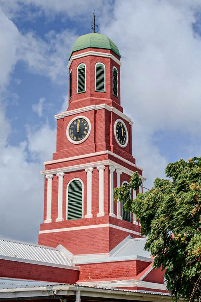 red clock tower in bridgetown