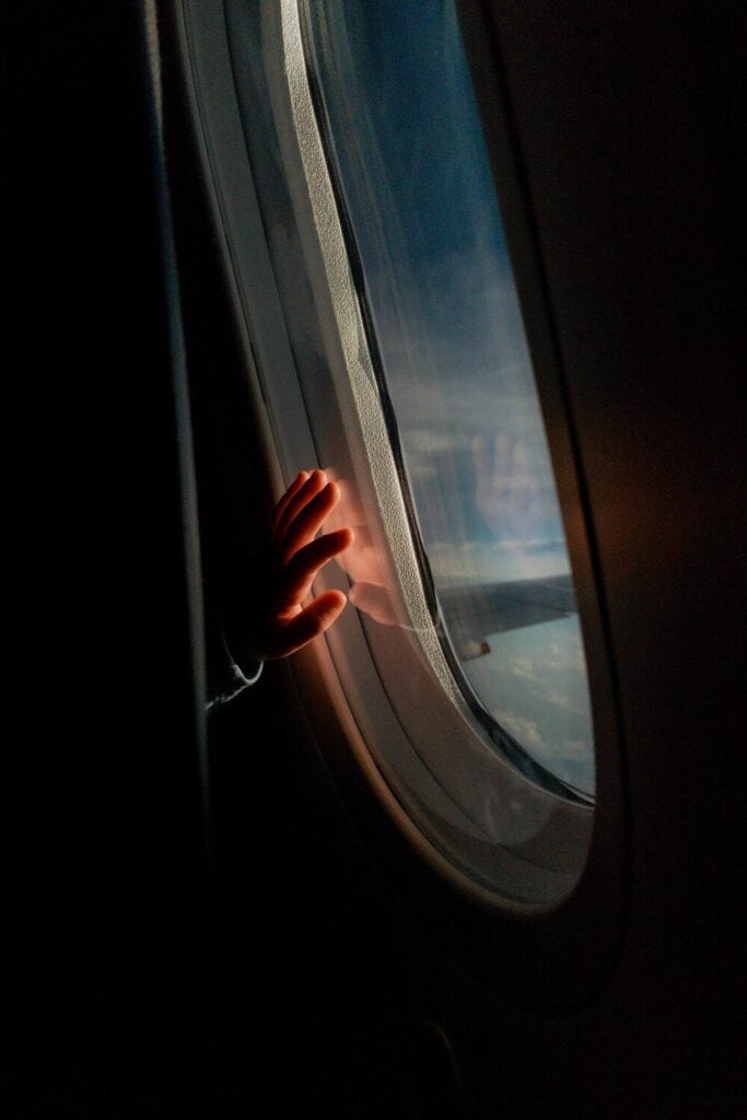 kid window seat on a plane