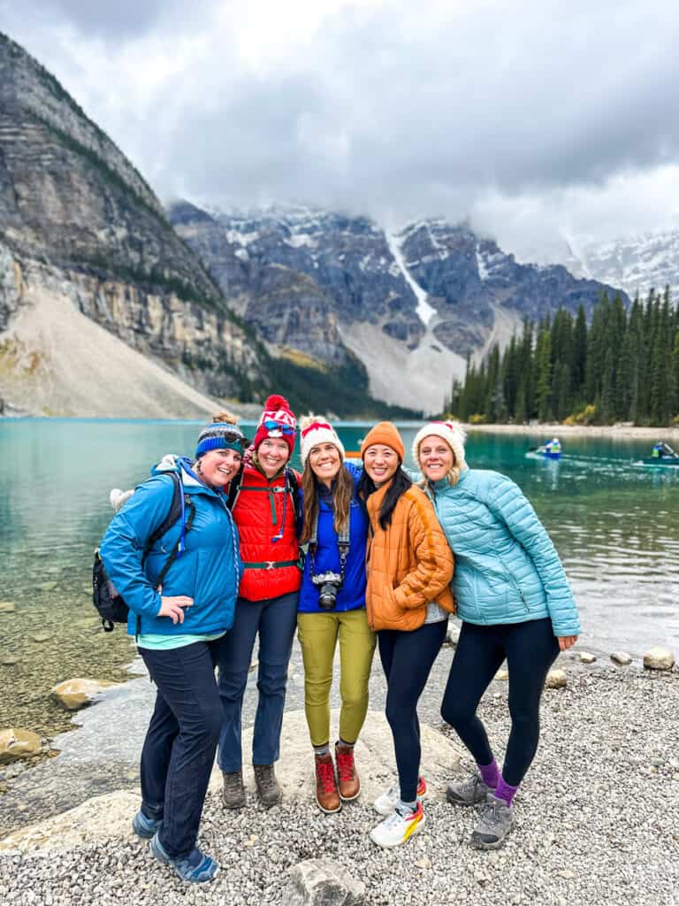 group of women posing in front of Lake Moraine