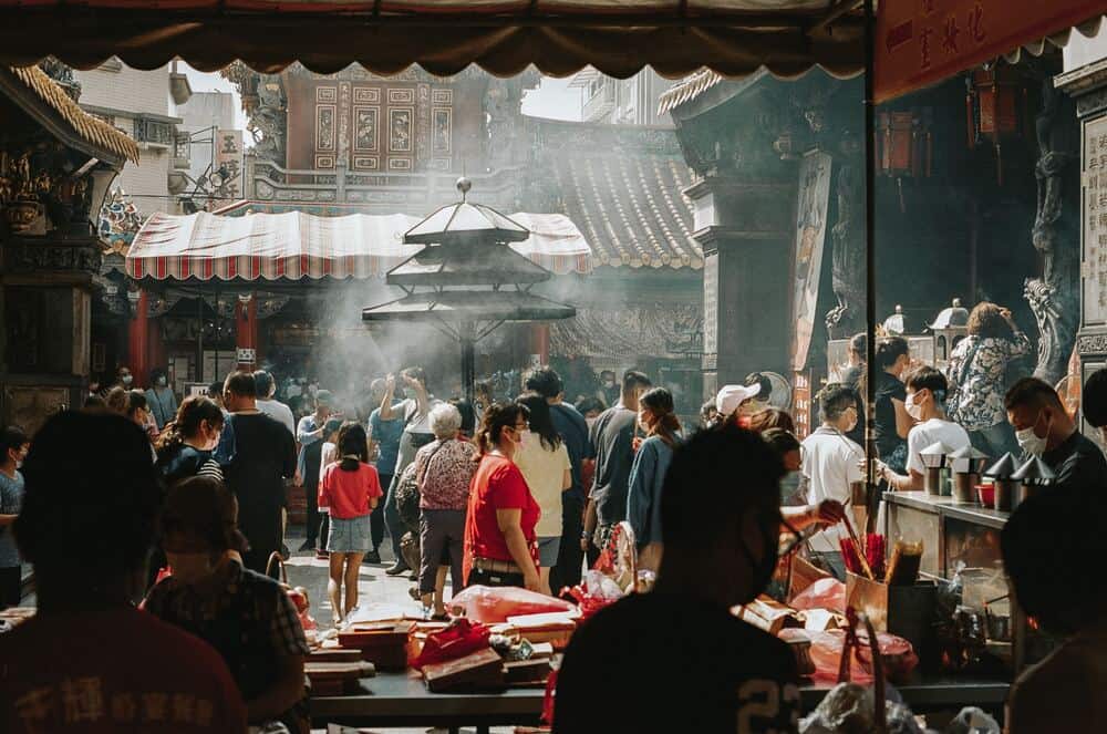 people in a temple courtyard