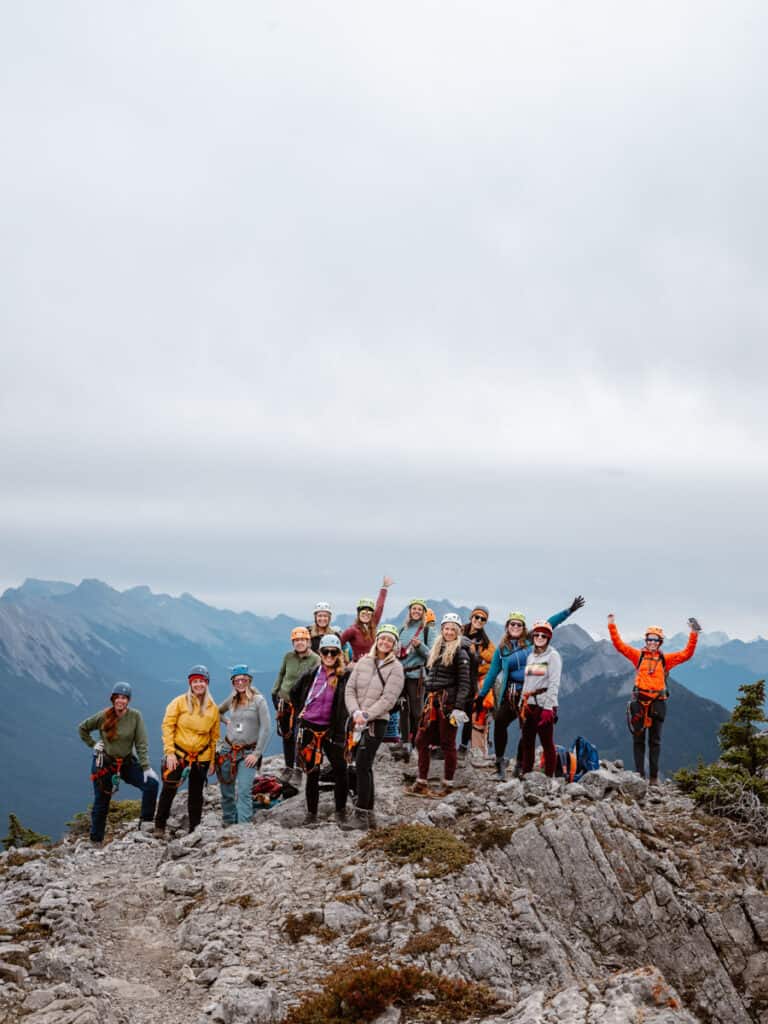 group of people on mountain top posing