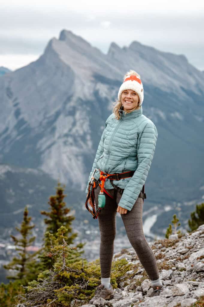 caz standing on mountain ridge with Banff views