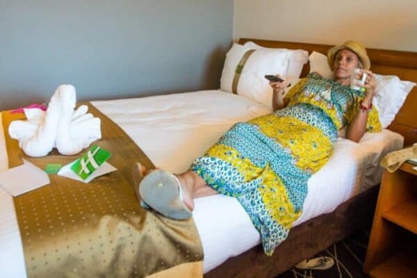 lady lying on hotel bed
