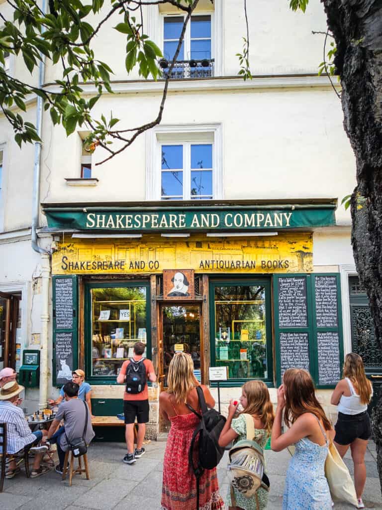 woman and children looking at Shakespeare and co bookstore