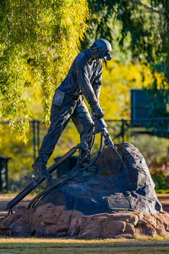 statue of man mining