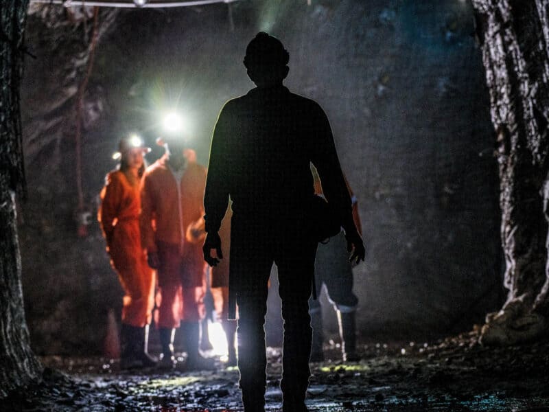group of people in underground mine