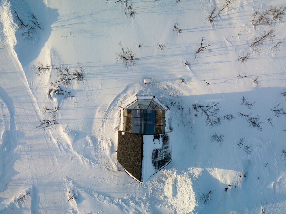 aerial view of yurt in the snow