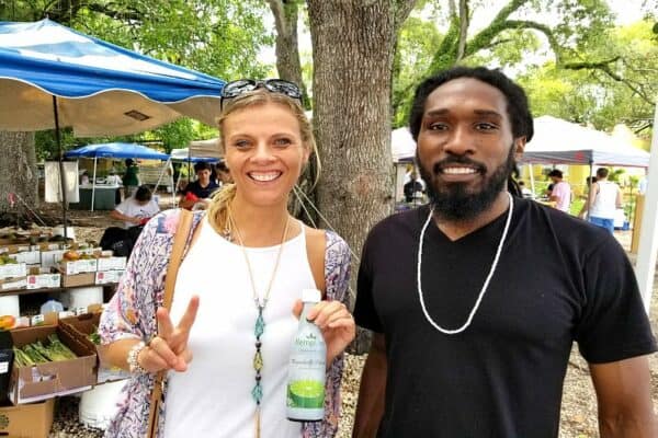 man and woman at markets posing to camera